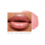 Na obrázku jsou rty modelky nalíčené odstínem Pink Glace. Barva je jemná světle růžová s decentním leskem a drobnými třpytkami, které dodávají rozjasňující efekt.