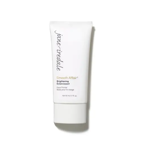 Na obrázku je vidět bílá tubička báze pod make-up Jane Iredale Smooth Affair Brightening Face Primer. Na obalu jsou černo-zlaté nápisy s názvem produktu. Produkt rozjasňuje a vyhlazuje pleť a připravuje ji na aplikaci make-upu.
