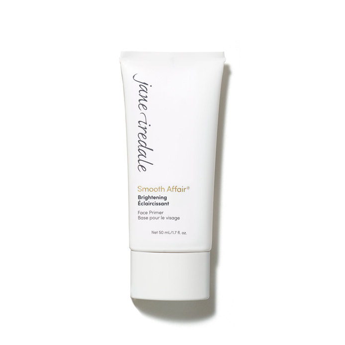 Na obrázku je vidět bílá tubička báze pod make-up Jane Iredale Smooth Affair Brightening Face Primer. Na obalu jsou černo-zlaté nápisy s názvem produktu. Produkt rozjasňuje a vyhlazuje pleť a připravuje ji na aplikaci make-upu.