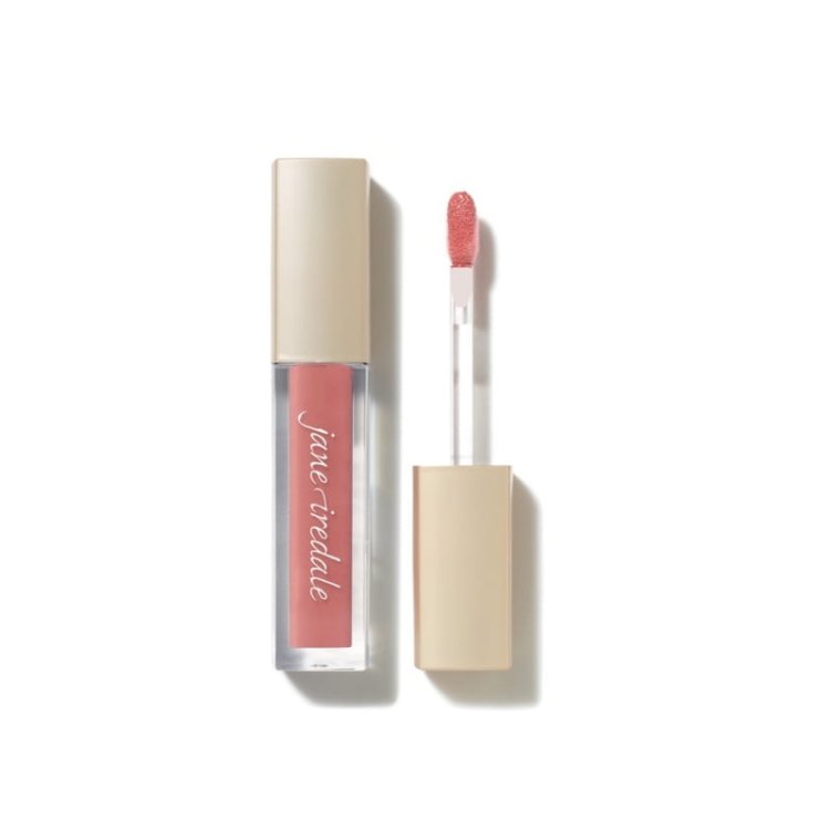 Na obrázku je lesk na rty značky Jane Iredale v intenzivním fialovo-růžovém odstínu. Produkt je v elegantním balení s béžovým víčkem a průhlednou spodní částí, která zvýrazňuje barvu kosmetiky.