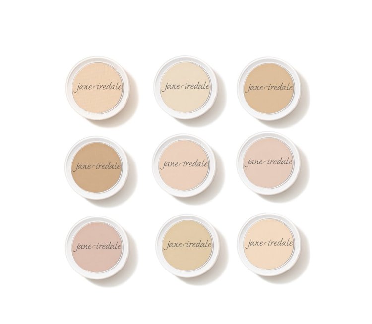 Na fotografii je vidět devět kulatých pudrů v mini verzi značky Jane Iredale, uspořádaných do mřížky 3x3. Každý z nich má jiný odstín – od velmi světlých po mírně tmavší tóny, ideální pro přizpůsobení různým typům pleti.