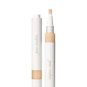 Na fotografii je korektor se štětečkovým aplikátorem značky jane iredale. Je vidět otočný obal s vestavěným aplikátorem ve formě štětečku a uzávěrem. Produkt je určen k rozjasnění očního okolí a zakrytí tmavých kruhů pod očima.