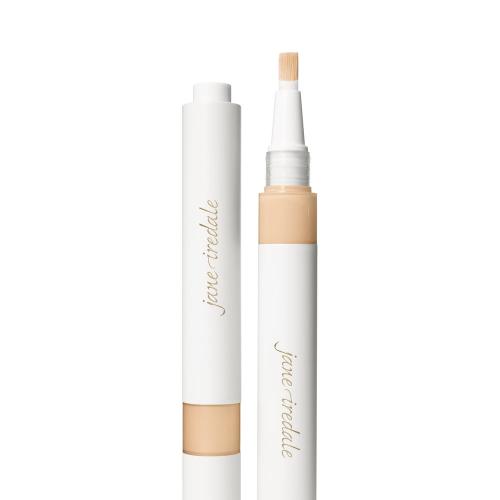 Na fotografii je korektor se štětečkovým aplikátorem značky jane iredale. Je vidět otočný obal s vestavěným aplikátorem ve formě štětečku a uzávěrem. Produkt je určen k rozjasnění očního okolí a zakrytí tmavých kruhů pod očima.