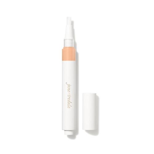 Na fotografii je korektor se štětečkovým aplikátorem značky jane iredale. Je vidět otočný obal s vestavěným aplikátorem ve formě štětečku a uzávěrem. Produkt je určen k rozjasnění očního okolí a zakrytí tmavých kruhů pod očima.