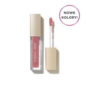 Na zdjęciu widoczny jest błyszczyk do ust marki Jane Iredale w intensywnym, fioletowo-różowym odcieniu. Produkt znajduje się w eleganckim opakowaniu z beżową nakrętką i przezroczystą częścią dolną, która eksponuje kolor kosmetyku.